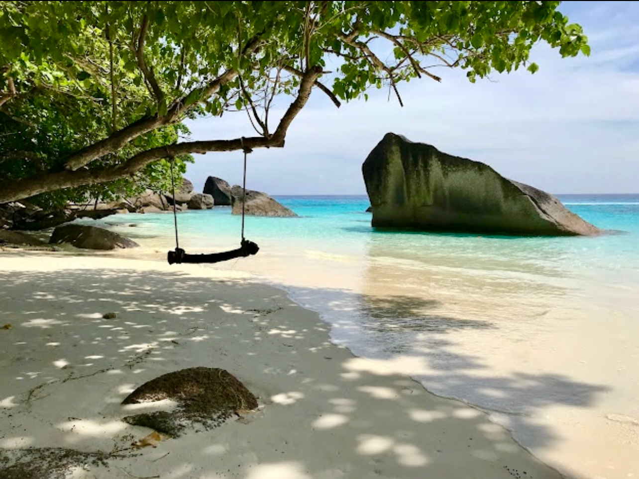 Guests enjoying lunch and beach time on the Similan Islands day trip from Khao Lak