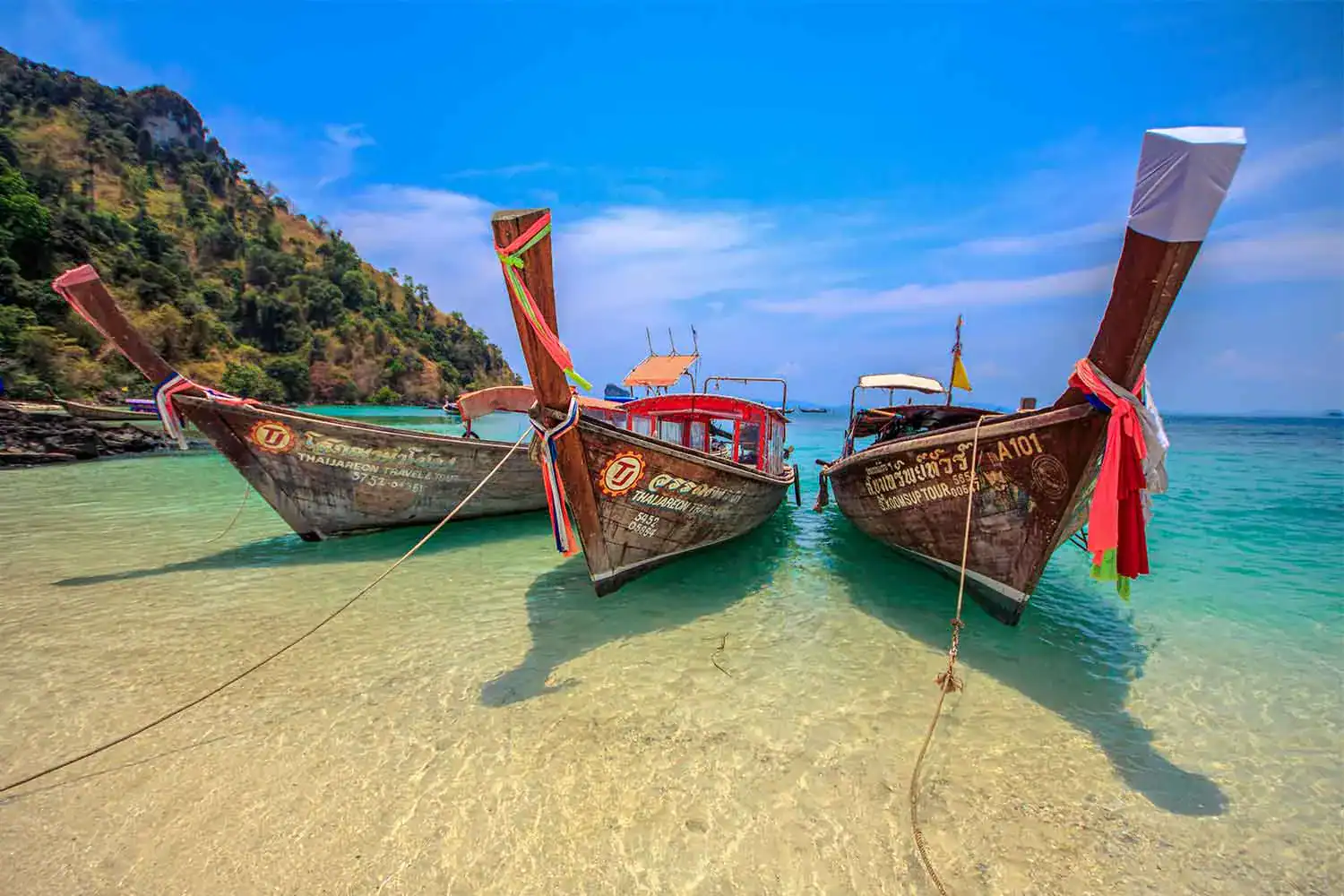 Traditional longtail boats at Railay in Krabi, gateway to rock climbing and the 4 Islands tour, Thailand