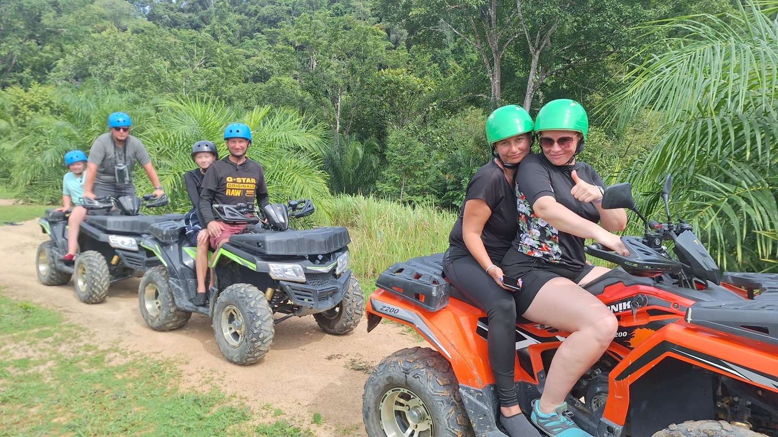 Family on ATV quad bike Khao Lak adventure tour jungle trails Thailand