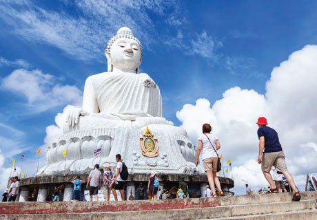 Tourists visiting the iconic Big Buddha statue on Nakkerd Hill during Phuket City Tour