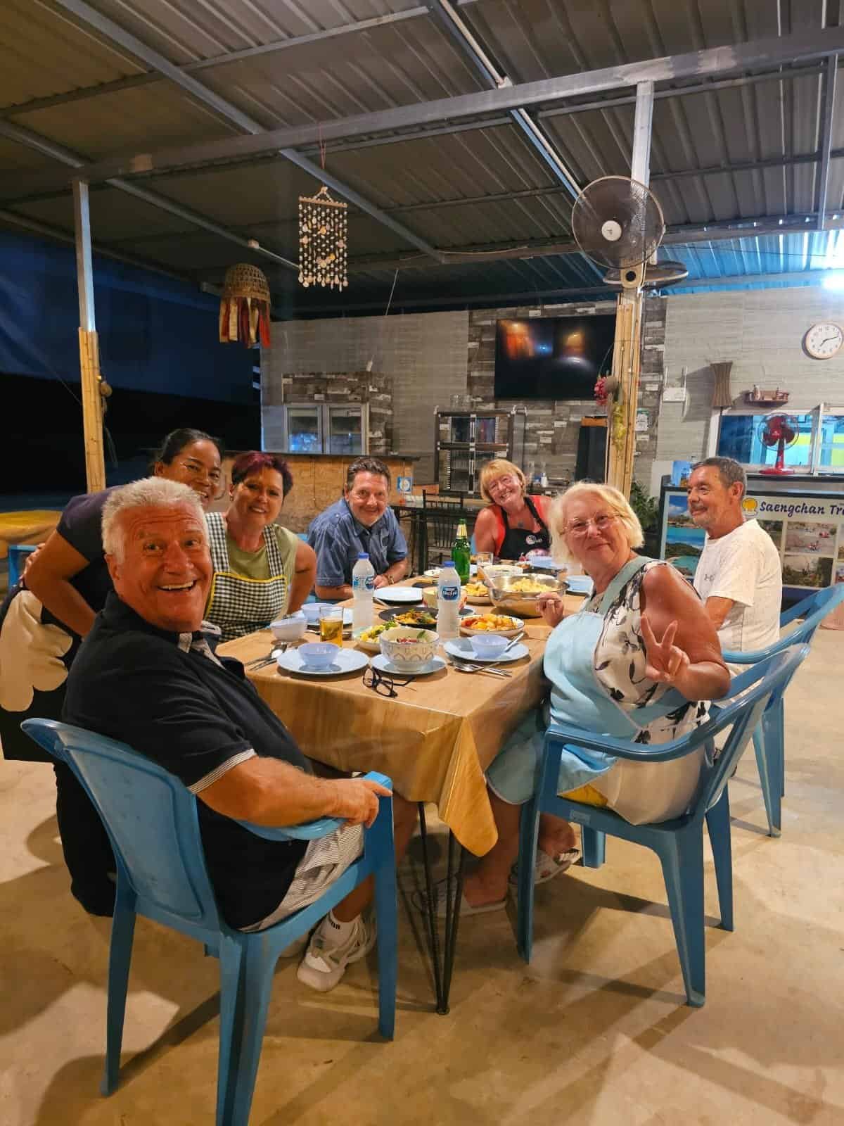 Guests enjoying the Thai food they cooked themselves in Khao Lak
